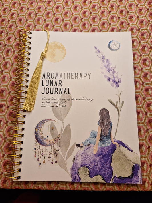 Aromatherapy lunar journal with artistic design on a patterned background