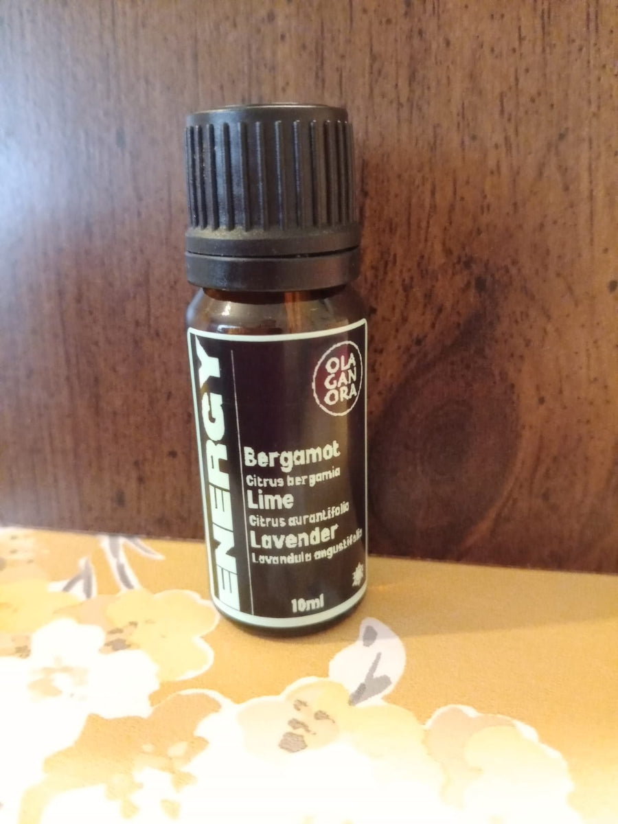 Energy aromatherapy diffuser blend in an amber bottle .Bergamot Essential Oil, Lime Essential Oil and Lavender Essential Oil.