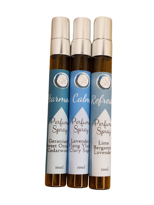 Three 10ml roll-on perfume spray bottles with silver caps and blue labels, arranged side by side on a white background. The labels read 'Harmony', 'Calm Refresher', and 'Perfume Spray' with scents Geranium, Sweet Orange, Clary Sage, Lavender, Bergamot, and Lavender.